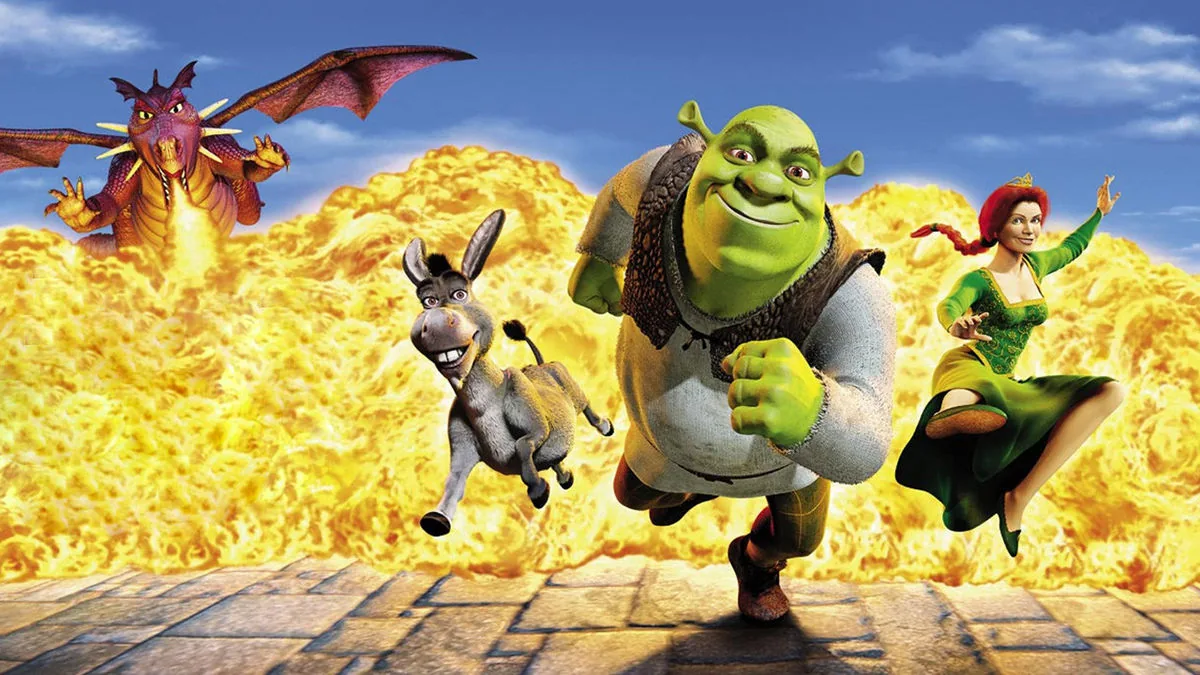 Shrek filminde Shrek, Eşek ve Prenses Fiona alevler önünde koşarken ejderha arkalarından geliyor