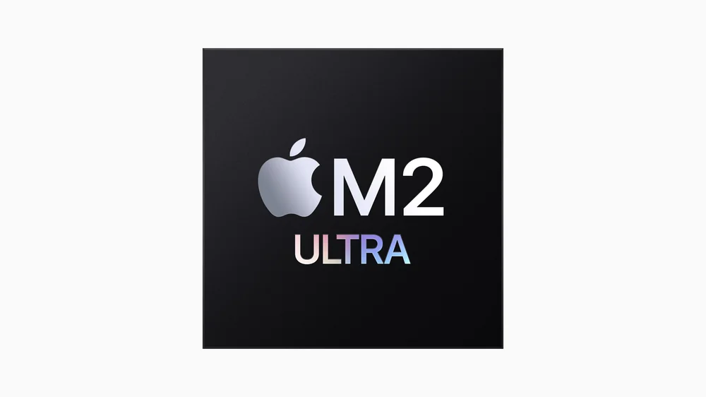 Apple M2 Ultra yapay zeka çipinin karanlık arka planda parlayan resmi Apple görseli
