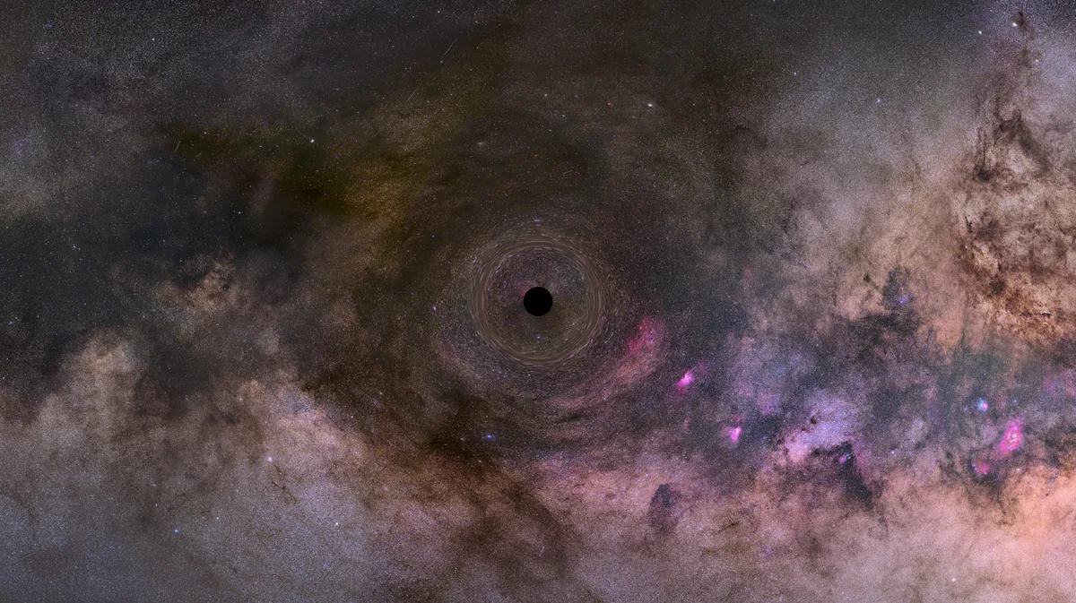 Işığı büken ve olay ufkuyla arka plandaki yıldızları görsel olarak çarpıtan tek başına bir kara deliğin NASA Hubble illüstrasyonu