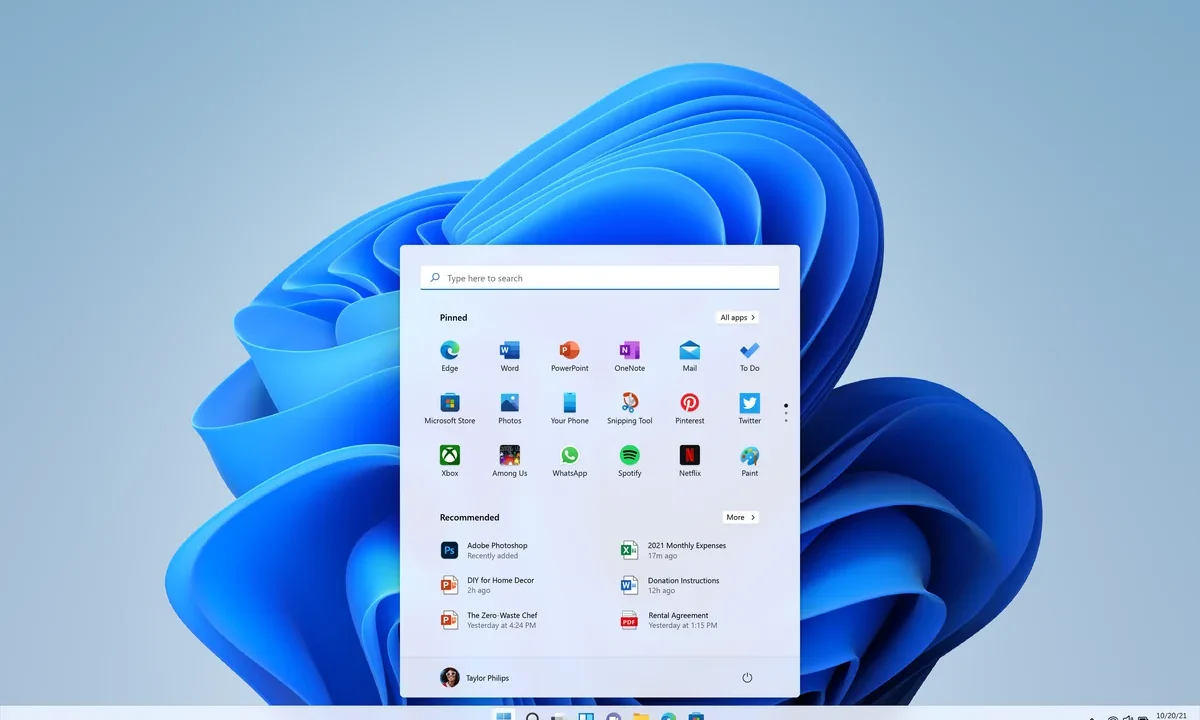 Windows 11 masaüstü, Başlat menüsü ve görev çubuğunda sabitlenmiş uygulama simgeleri; görev çubuğundan uygulama sonlandırma konusunu temsil eden resmi Microsoft görseli